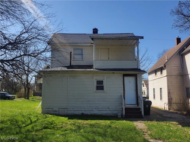 9615 Dunlap Ave, Cleveland, OH 44105 - back of property with a yard and entry steps