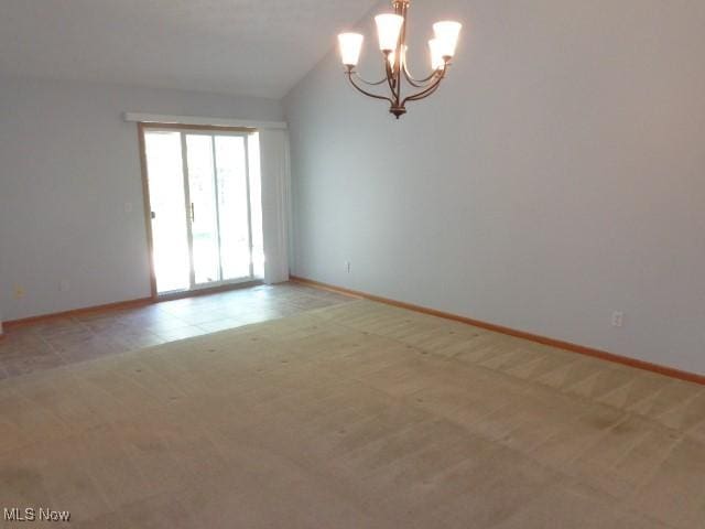 empty room with an inviting chandelier, baseboards, and light carpet