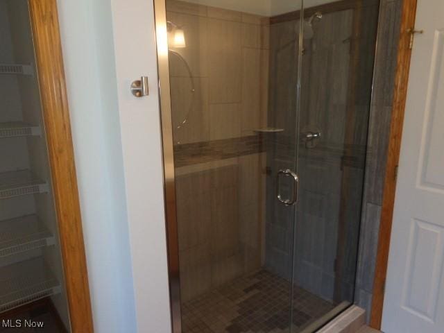 full bathroom featuring a shower stall