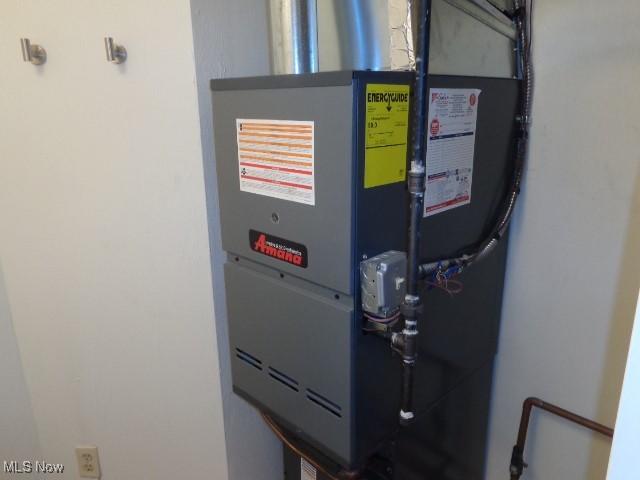 utility room with heating unit
