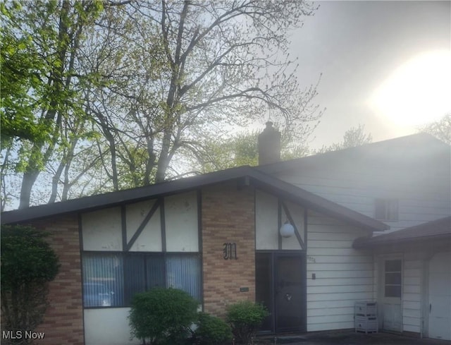 6876 Anthony Ln, Parma Heights, OH 44130 - exterior space with brick siding and a chimney