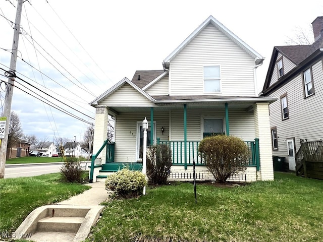view of front facade with a porch and a front yard