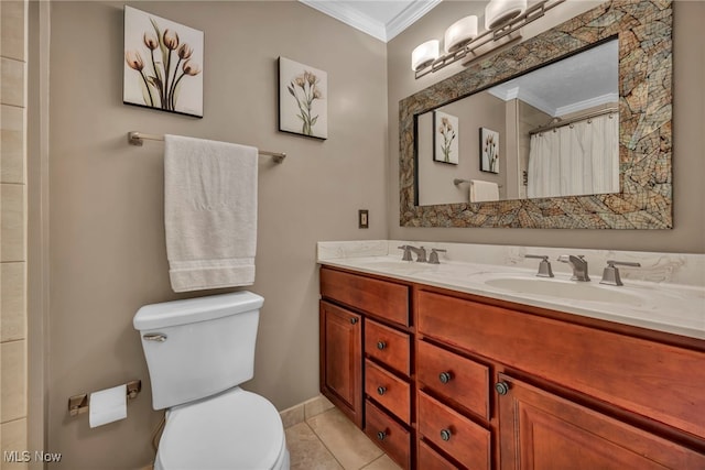 bathroom featuring a sink, crown molding, toilet, and double vanity