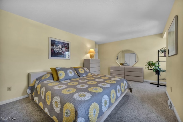 carpeted bedroom with baseboards