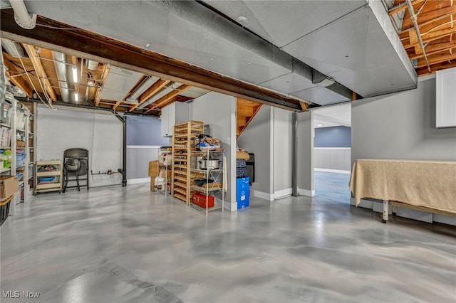 unfinished basement featuring baseboards