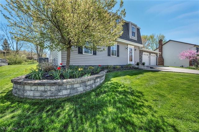 view of front of home featuring a shingled roof, a garage, a front yard, concrete driveway, and mansard roof