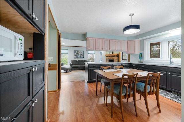 dining area with light wood-style floors