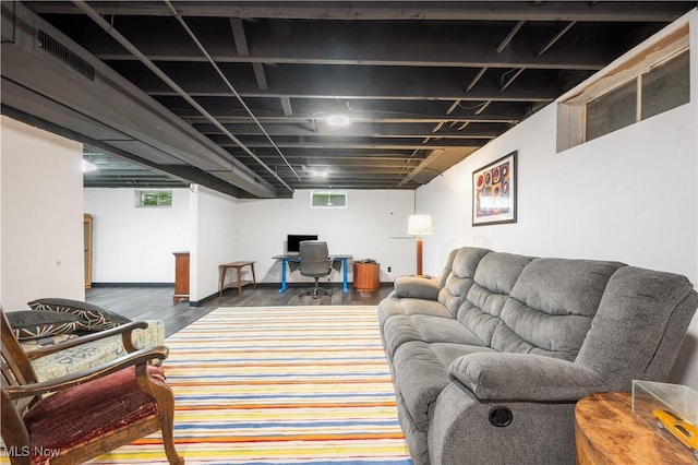 living area featuring wood finished floors and visible vents