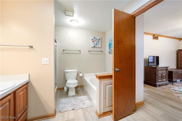 full bathroom with vanity, a garden tub, wood finished floors, toilet, and a shower stall
