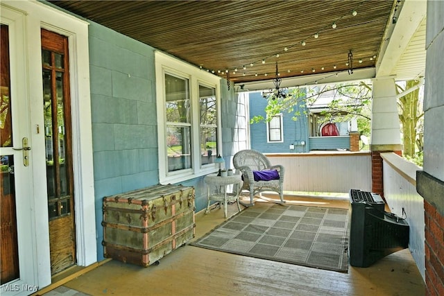 sunroom / solarium featuring wood finished floors