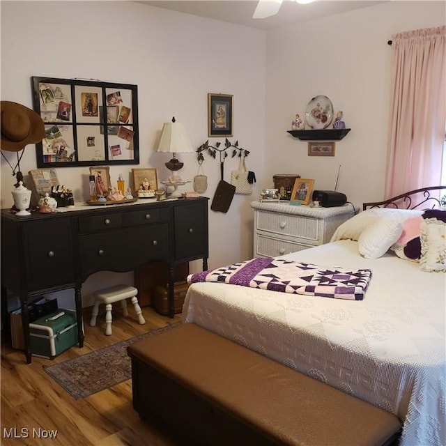 bedroom with wood finished floors