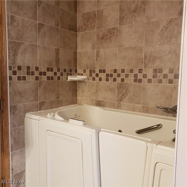 full bathroom with a tub to relax in