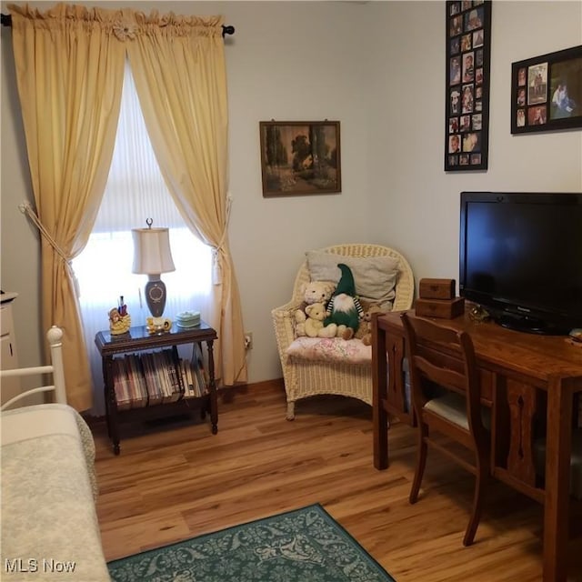 sitting room featuring wood finished floors