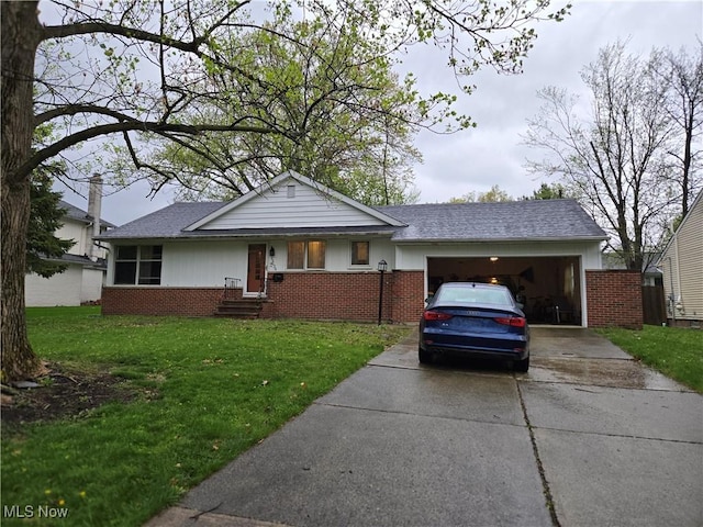 ranch-style house with a front lawn, brick siding, entry steps, an attached garage, and driveway