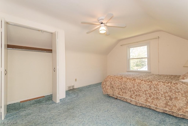 unfurnished bedroom featuring vaulted ceiling, ceiling fan, carpet flooring, and visible vents