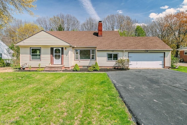 single story home featuring driveway, a chimney, a front yard, an attached garage, and a shingled roof