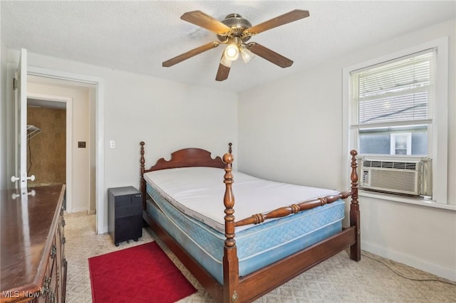 bedroom featuring baseboards, light colored carpet, ceiling fan, and cooling unit