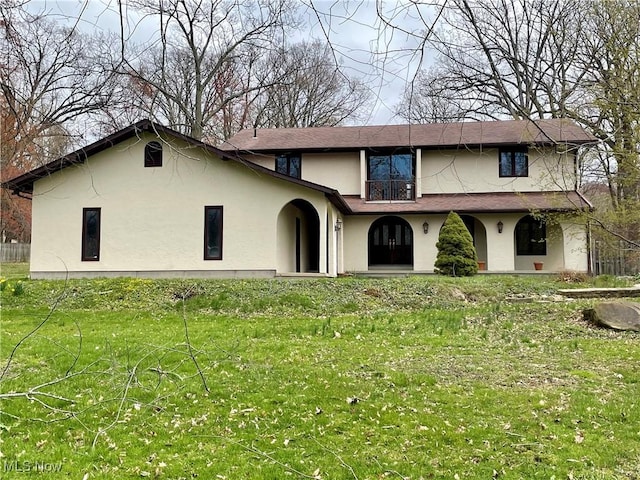 1995 Claus Rd, Vermilion, OH 44089 - view of front of home featuring stucco siding and a front lawn
