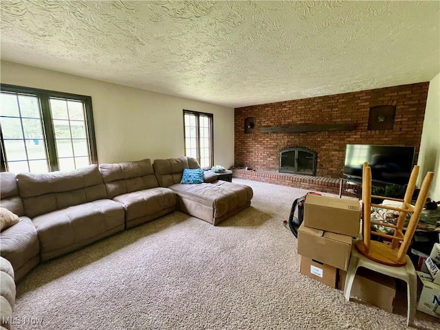 1995 Claus Rd, Vermilion, OH 44089 - carpeted living room with a textured ceiling and a fireplace