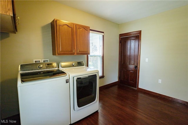 washroom featuring independent washer and dryer, baseboards, dark wood-style floors, and cabinet space