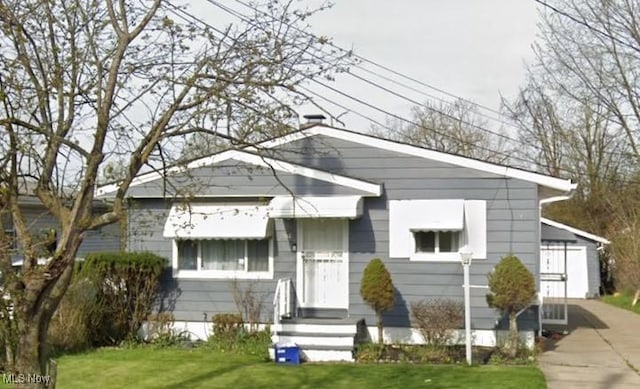 bungalow with a front yard