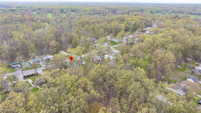 aerial view featuring a wooded view