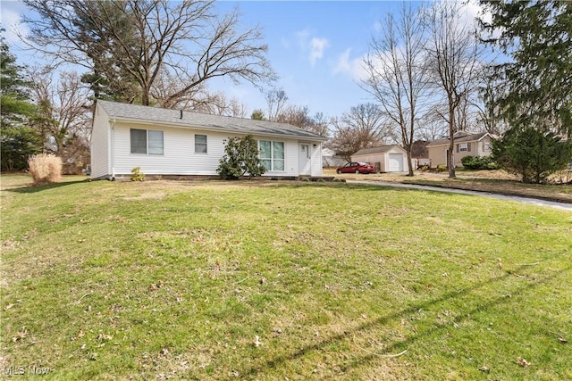 449 W Long Lake Blvd, Akron, OH 44319 - ranch-style home with a detached garage, an outdoor structure, a front yard, and aphalt driveway