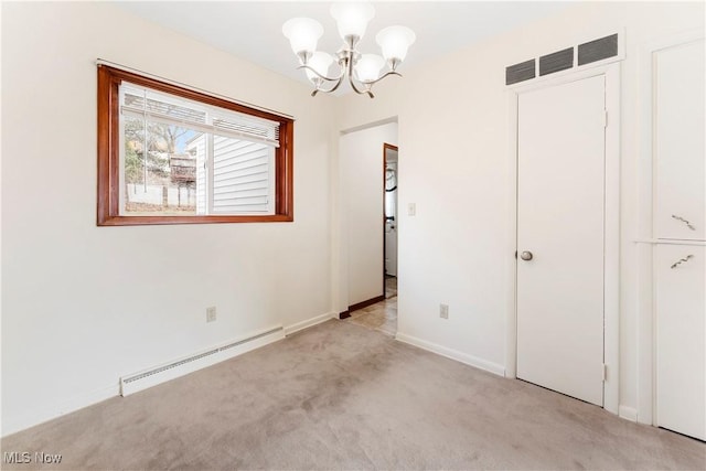 449 W Long Lake Blvd, Akron, OH 44319 - interior space featuring visible vents, baseboards, baseboard heating, light colored carpet, and a notable chandelier