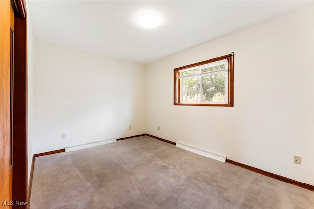 449 W Long Lake Blvd, Akron, OH 44319 - carpeted empty room featuring baseboards, a baseboard heating unit, and a baseboard radiator