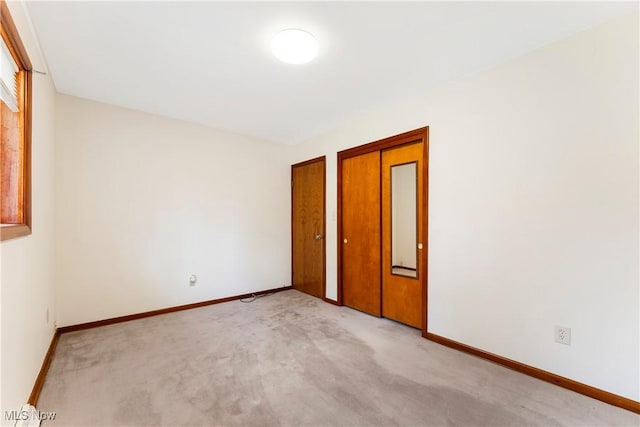 449 W Long Lake Blvd, Akron, OH 44319 - unfurnished bedroom featuring baseboards, multiple closets, and light carpet