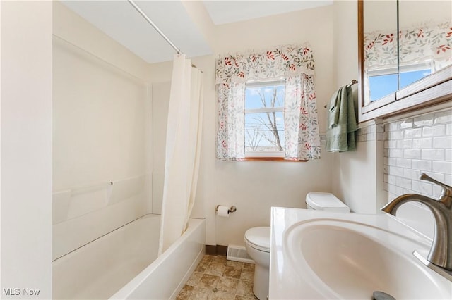 449 W Long Lake Blvd, Akron, OH 44319 - full bath with a sink, baseboards, shower / bath combo with shower curtain, and toilet