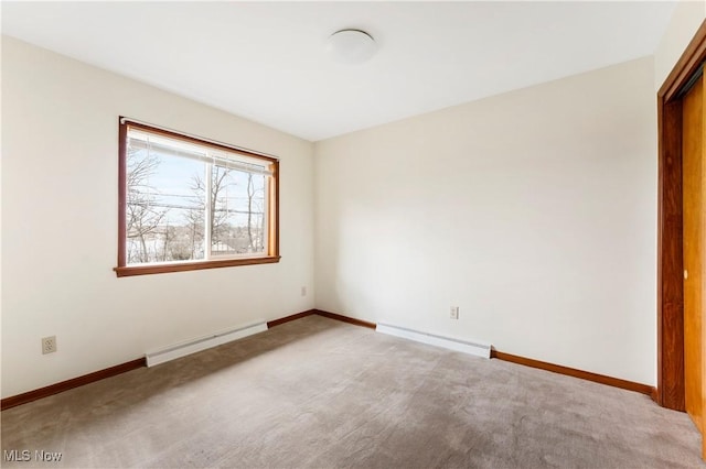 449 W Long Lake Blvd, Akron, OH 44319 - unfurnished room featuring light colored carpet, baseboards, and a baseboard heating unit
