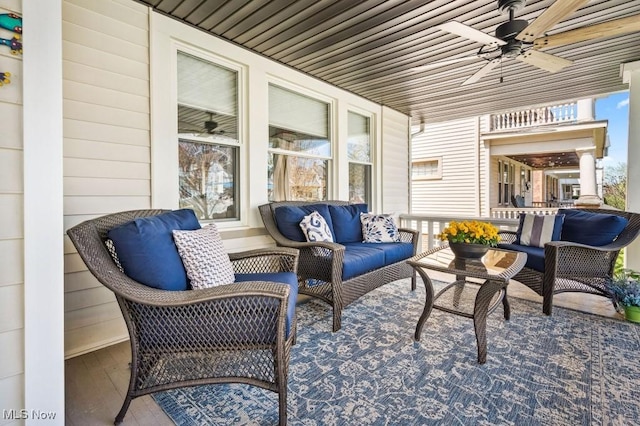 view of patio / terrace with an outdoor hangout area, a ceiling fan, and a porch