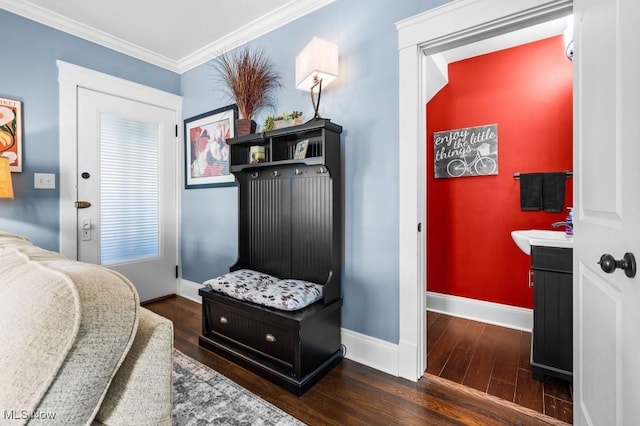 mudroom with a sink, baseboards, ornamental molding, and wood finished floors