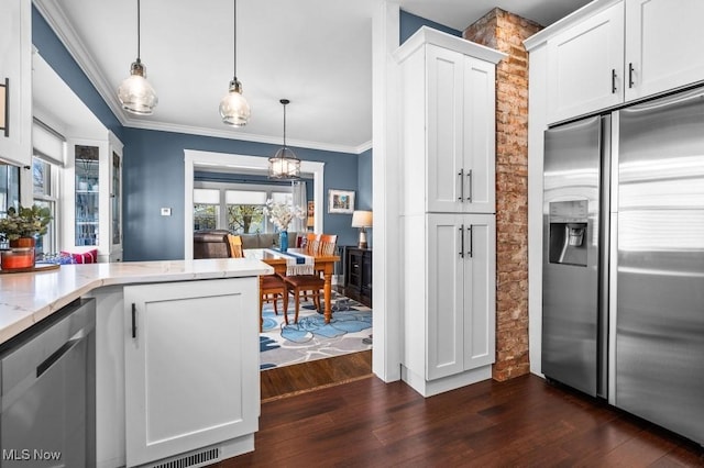 kitchen with white cabinetry, appliances with stainless steel finishes, dark wood-style floors, and light stone countertops
