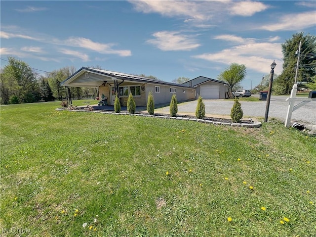 view of front of property with a porch, a garage, a front yard, and gravel driveway