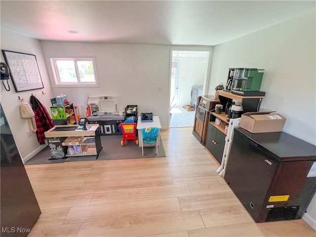 playroom featuring light wood-type flooring