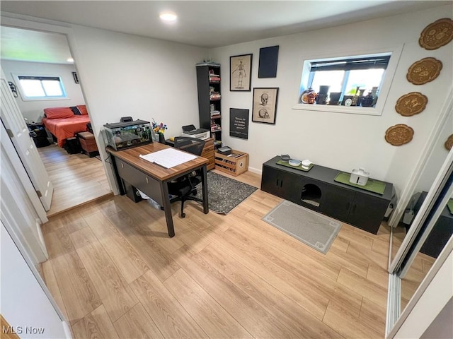 office space featuring light wood-style floors and recessed lighting