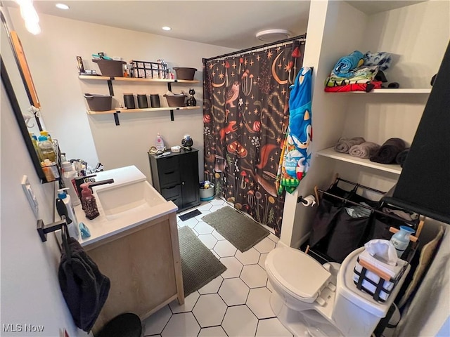 bathroom with recessed lighting, a shower with curtain, toilet, and vanity