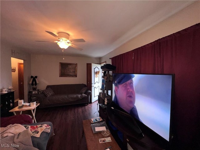 living area with ceiling fan and wood finished floors