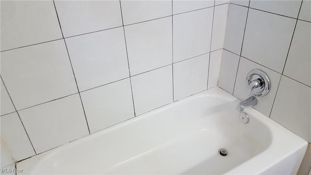 full bathroom with a tub to relax in