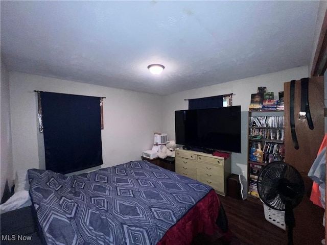 bedroom featuring wood finished floors