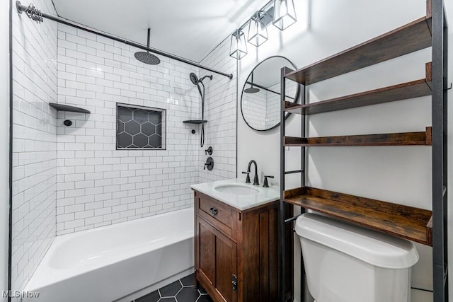 bathroom with vanity, tile patterned flooring, bathtub / shower combination, and toilet