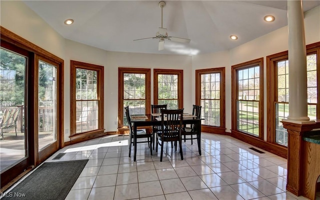 dining space featuring visible vents, a ceiling fan, decorative columns, and plenty of natural light