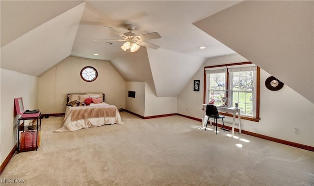 carpeted bedroom featuring baseboards, a ceiling fan, and vaulted ceiling