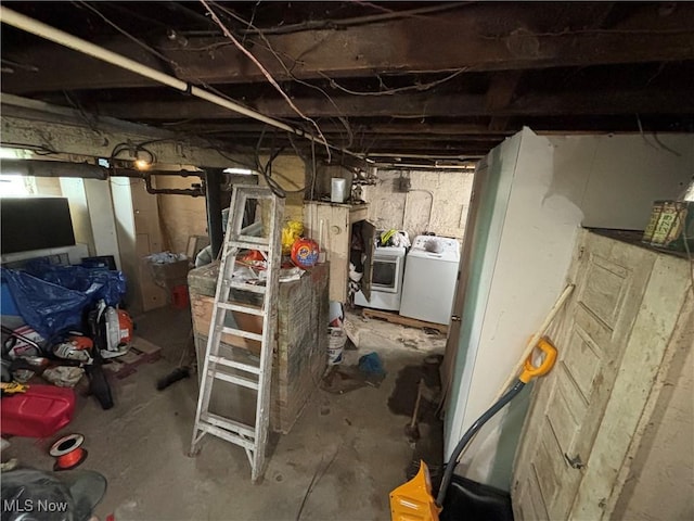unfinished below grade area featuring washer and dryer