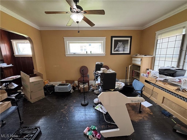 office space featuring plenty of natural light, a ceiling fan, and crown molding