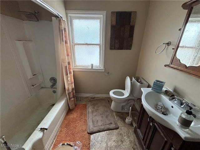 bathroom featuring toilet, baseboards, shower / tub combo with curtain, and vanity