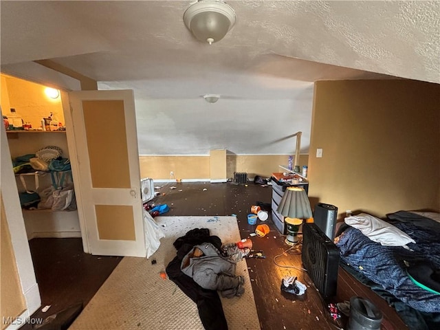carpeted bedroom featuring a walk in closet