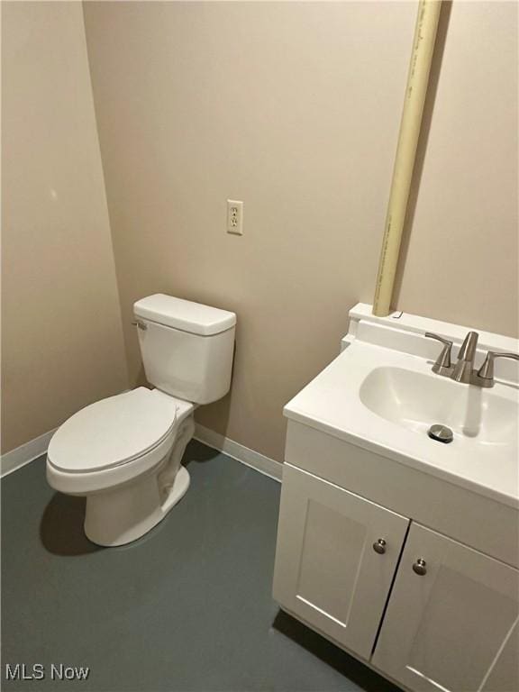 8995 Sarbaugh Rd, Norwich, OH 43767 - bathroom with baseboards, vanity, and toilet